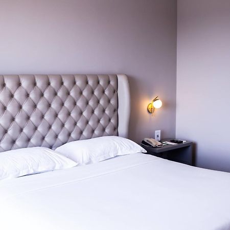 Ouro Minas Hotel Belo Horizonte, Dolce By Wyndham Екстер'єр фото A bedroom at the hotel